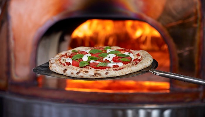 Wood-fired pizzas with fresh ingredients, including the spicy "Hell Bent" pizza.